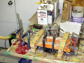 The blade clamped in the moulds